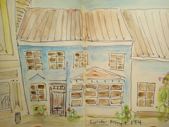 Watercolor sketch of the front of a blue house, tucked right up against it's neighbors in a row. The rectangular windows are dark, with white frames around the panes. A brown shingles roof slants down to meet the gutter, casting a shadow over the windows on the second floor. A few green plants curl up from the pavement outside. The windows of the yellow house on the left can be seen. The caption reads "Curator Prompt 184".