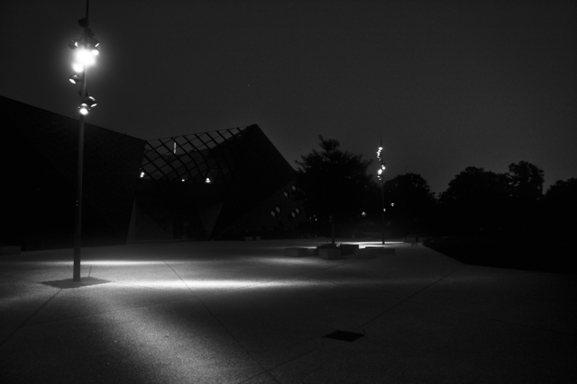 Black and white late night urban scenery.
Secret rendezvous for lonely lights.with protected intimate spaces.