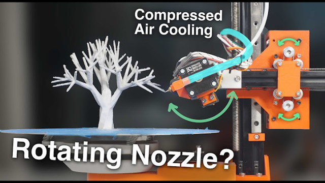 side view of a novel 3d printer with spinning bed, “core X” head gantry, and a rotating head on the end that has compressed air tubing for cooling