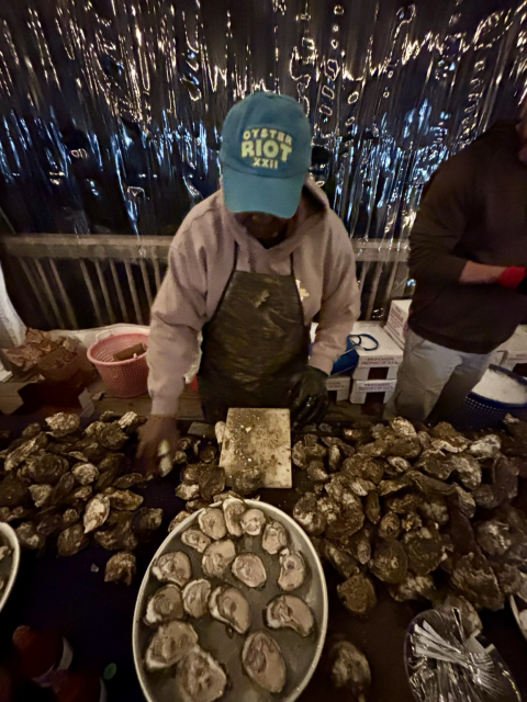 Local waterman shucking oysters 