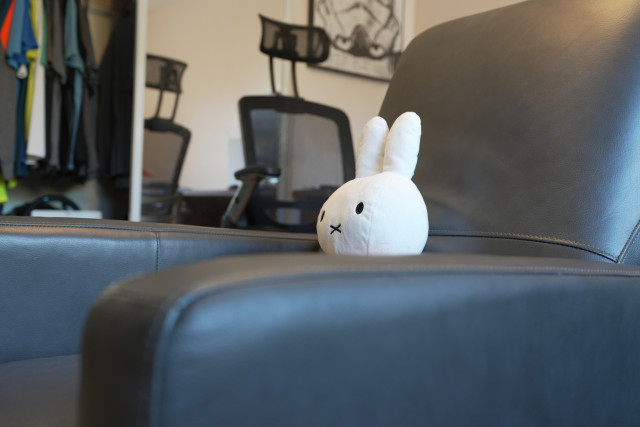 Miffy sitting in a chair watching TV off screen. 