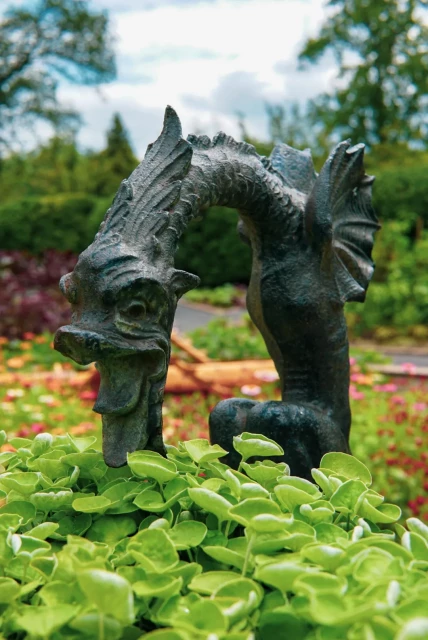 a dragon statue in a local garden