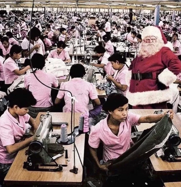 Santa in a sea of workers toiling away. Santa looks all fascist in this context.