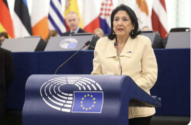 Georgian President Salome Zourabichvilli standing at the lectern of European Parliament giving an address 