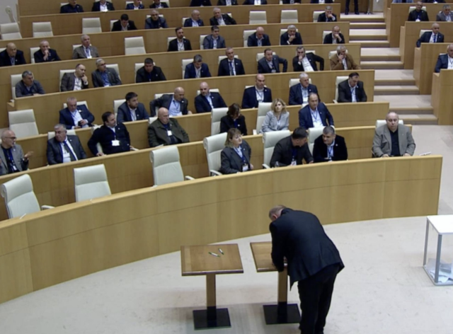 Georgian Parliament as a politician casts his vote in the presidential election.