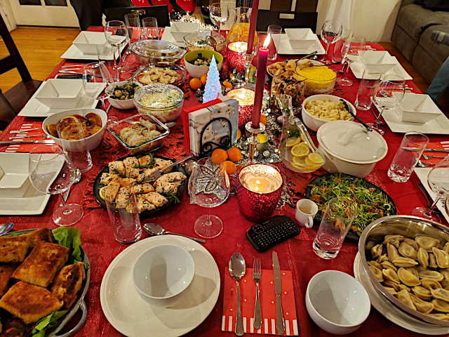 Picture of Christmas Eve table with traditional Polish cuisine.