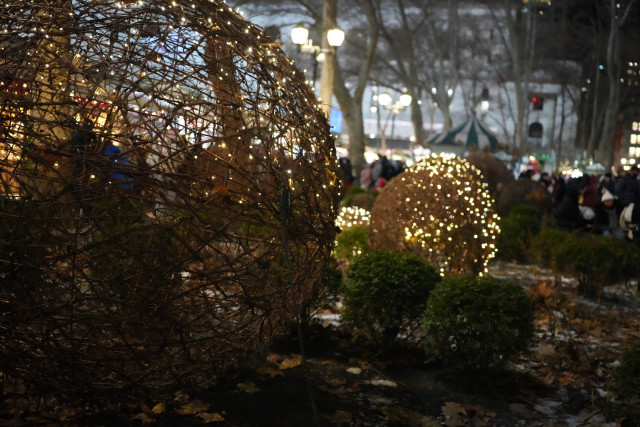 Glowing wire globes at Bryant Park.