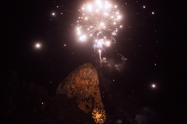 Fireworks in the sky over a mountain in Railay Beach, Thailand.