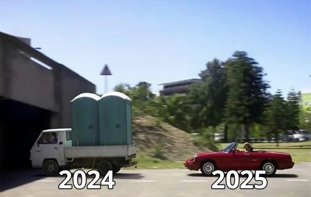 A nice red Sportscar drives behind a little truck loaded with portable chemical toilets. The truck is marked 2024, the Sportscar is marked 2025. 
The road leads under a bridge. The bridge is clearly lower than the toilets.