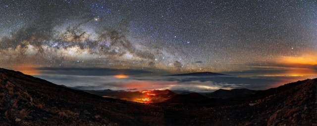 Down on the mountain at the center of the image, a snaking band of light marks the location of an access road. In the distance, the large cities on the Island of Hawai‘i light up spots under the clouds while the active volcano Mauna Loa rises above them.

Just like Mauna Loa, Maunakea is a shield volcano — though thankfully a dormant one. However, the volcanic past of Maunakea continues to be an asset to astronomers. The mountain’s smoothly sloping sides and high elevation are two of the factors that contribute to the exceptional observing conditions at the summit.

Credit:
International Gemini Observatory/NOIRLab/NSF/AURA/J. Chu 