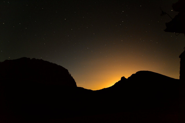 Seconds before the civil light reach our destination. Olympus Mountain . The first sunlight behind 2 mountain at Mt Olympus , Greece .