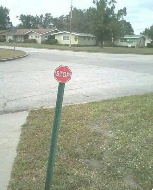 A stop sign but the hexadon part (the red sign that says stop) is tiny in relation to the normal post it's on.