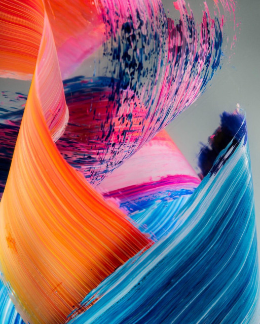 a detail of three-dimensional colorful brushstrokes captured inside clear resin