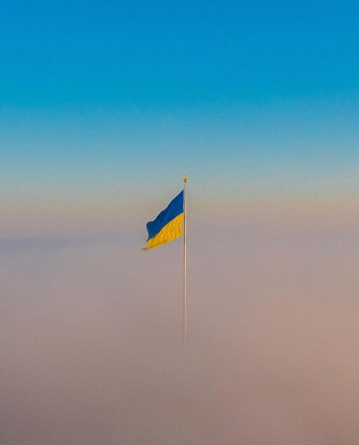 Photography. A color dronephoto of an Ukrainian national flag flying over fog.
Info: Drone: DJI Mavic pro2