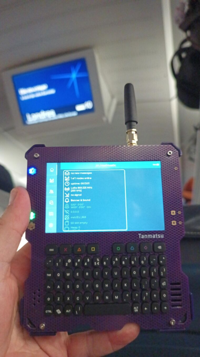 Tanmatsu with Meshtastic running with a Eurostar train destination board blurred in the background.
The meshtastic client shows no other stations detected, just itself
