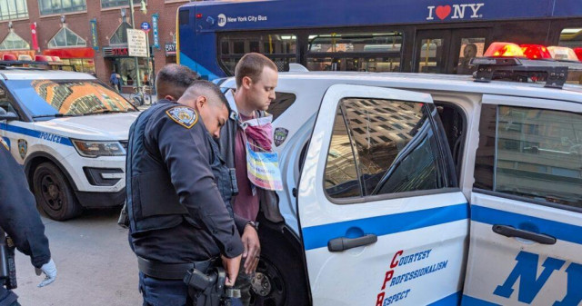 Armed man wearing 'non-offending pedophile' sign storms stage at NYC Wikipedia conference