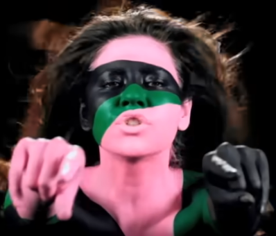 Screenshot of the Video and here are the lyrics:
You've been acting awful tough lately
Smoking a lot of cigarettes lately
But inside, you're just a little baby, oh
It's okay to say you've got a weak spot
You don't always have to be on top
Better to be hated than loved, loved, loved for what you're not

You're vulnerable, you're vulnerable
You are not a robot
You're lovable, so lovable
But you're just trouble

Guess what? I'm not a robot, a robot
Guess what? I'm not a robot, a robot

You've been hanging with the unloved kids
Who you never really liked and you never trusted
But you are so magnetic, you pick up all the pins
Never committing to anything
You don't pick up the phone when it ring-ring-rings
Don't be so pathetic, just open up and sing

I'm vulnerable, I'm vulnerable
I am not a robot
You're lovable, so lovable
But you're just trouble

Guess what? I'm not a robot, a robot
Guess what? I'm not a robot, a robot

Can you teach me how to feel real?
Can you turn my power off?
And let the drum beat drop?

