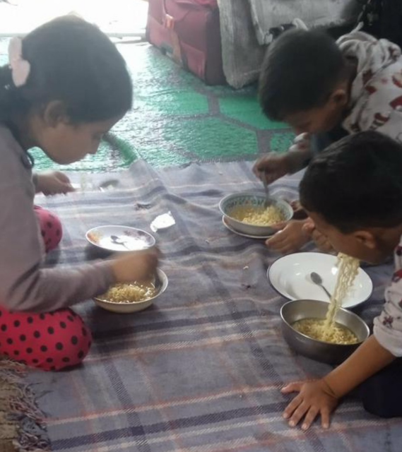 Aseel, Mahmoud and Osaid are eating indomie 