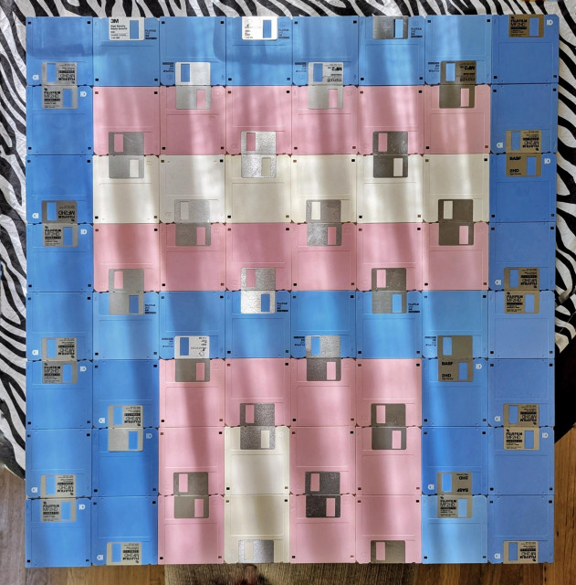 3.5" floppy disks arranged in a manner to resemble the Transgender Pride Flag