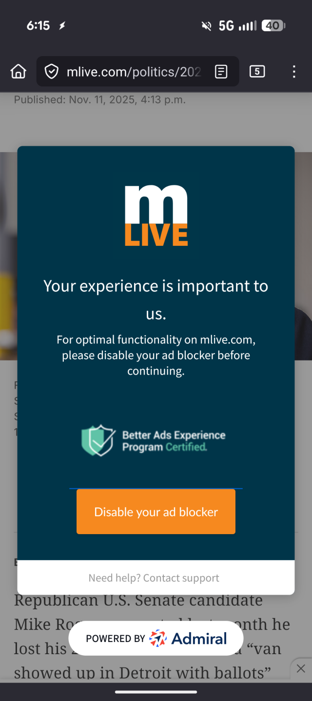 A screenshot showing an article on mlive.com, but you can't see the article because it's blocked by a big pop-up preventing you from accessing the page unless you disable your ad blocker.