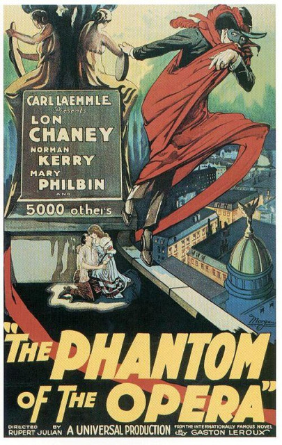 Theatrical release poster. The central figure is the Phantom, depicted in a dynamic pose. He is dressed in a black suit, a red cloak billowing behind him, and a black mask partially covering his face. He appears to be leaping or dramatically striding across a rooftop, adding a sense of action and suspense. His posture suggests a combination of menace and theatricality.

Below the Phantom, there is a scene of a couple, possibly lovers, embracing on a rooftop. The man is kneeling, and the woman is leaning towards him, suggesting a moment of intimacy or peril. The background shows a cityscape with buildings and a prominent domed structure, likely representing the opera house.

The background includes two classical figures, possibly representing muses or other allegorical figures. The text in the upper left corner lists the main actors: Lon Chaney, Norman Kerry, and Mary Philbin, along with the producer's name, Carl Laemmle. 