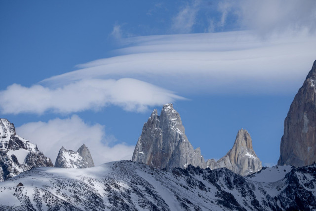 Some lenticular clouds above the summits of Aguja de ls S and Aguja Saint-Exupery