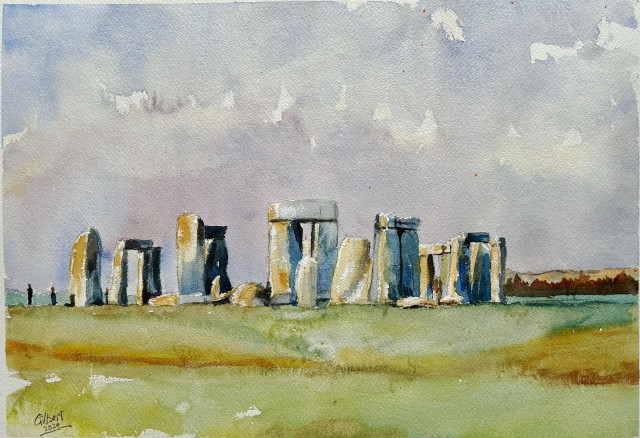 A watercolor painting of Stonehenge, showcasing the iconic stone structure set against a sky with subtle clouds and a grassy foreground.