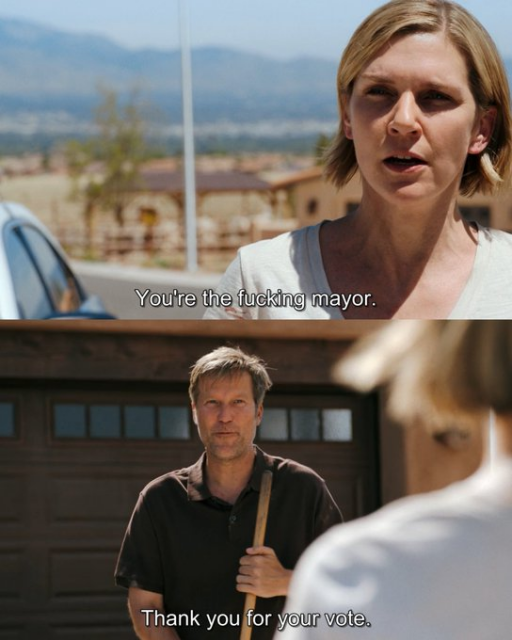 A two-panel screencap meme featuring actors Rhea Seehorn and Tim Keller.

Top Panel: Rhea Seehorn looks concerned and frustrated, speaking to the man opposite her in an outdoor setting. The subtitle reads: "You're the fucking mayor."

Bottom Panel: Tim Keller stands in a residential driveway holding a garden tool, looking back with a polite but blank expression. The subtitle reads: "Thank you for your vote."