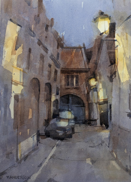 Watercolor painting of a side street off Oude Burg in Bruges, Belgium. A dusk sky in cool blue-purple is suspended above a cobbled stoned alley lit by bright yellow street lamps lining the buildings on the right. The light is cast against the facades lining the street and falling lightly on a parked car sitting cozily on the sidewalk. The building in the background has an arched garage below a set of windows.
