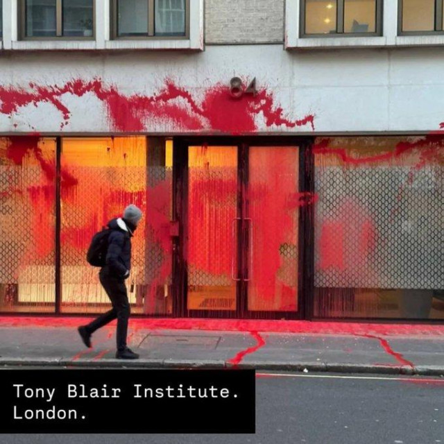 Picture of the front of a building covered in red paint.