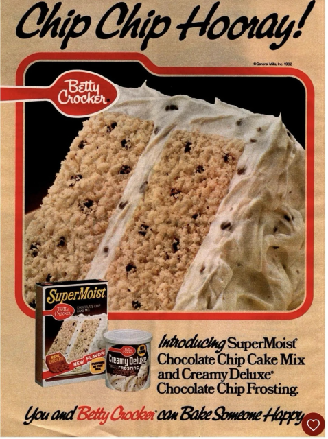 The advertisement has a very large image of a slice of cake on its side. The cake is a tan colored two layered cake. You can see chocolate chips inside the cake. The cake is also frosted with a white creamy feathered frosting. The frosting also has specs of chocolate chips. Above is the classic logo for Betty Crocker. Below discusses the delicious cake and it’s simplicity to make.