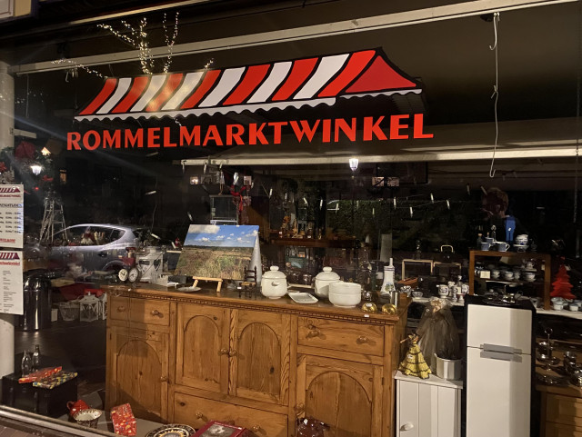 Store front. A bunch of crap and the store name