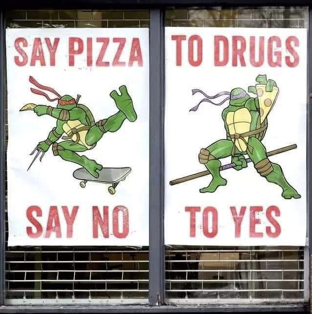 A photo of two signs with the Teenage Mutant Ninja Turtles, meant to say 'Say No To Drugs, Say Yes To Pizza' but due to some unknown mishap, the signs now read 'Say Pizza To Drugs, Say No To Yes'