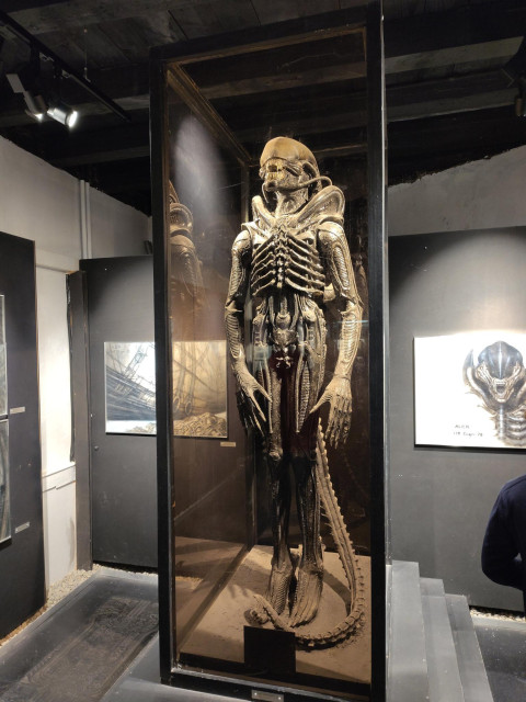 The original Alien costume from the movie Alien, in a display case at the HR Giger Museum in Switzerland