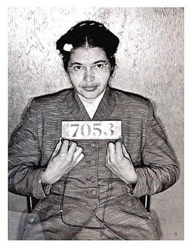Mugshot of Rosa Parks after her arrest. She is a black woman with glasses.