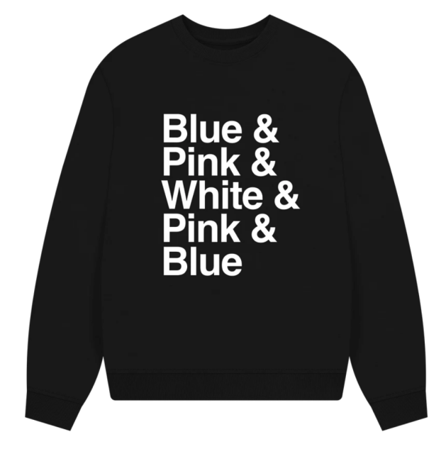 The text Blue and Pink and White and Pink and Blue in white on a black sweater.