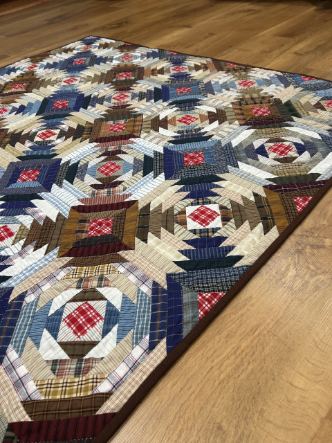 an angled view of the pineapple from closer to the floor. This view highlights the individual fabrics. Some are very densly patterned and some are very light. Each block is broadly symmetrical though cuts may impact the effect.