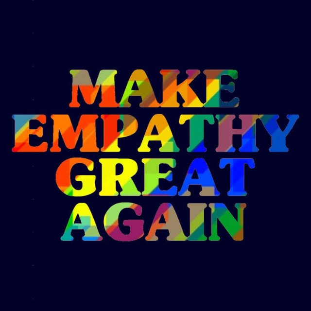 Dunkelblauen Hintergrund  mit dem Text :"MAKE EMPATHY GREAT AGAIN" in Regenbogfarben.