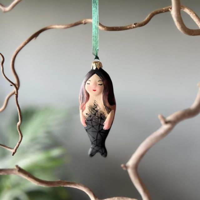 A Christmas tree decoration in the shape of a mermaid.