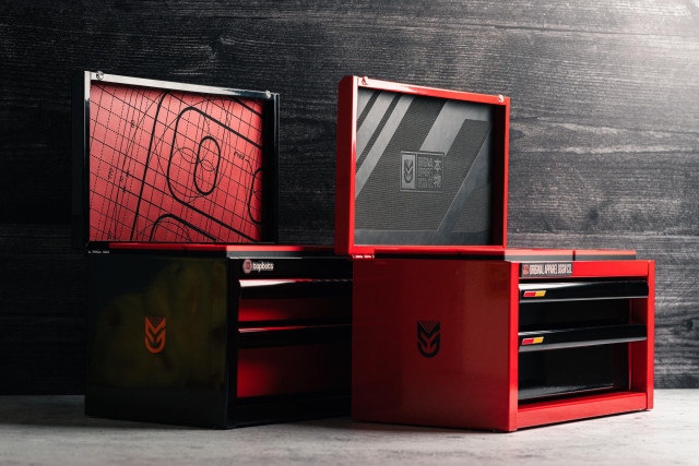 Photo of 2 customized Harbor Freight mini toolboxes. One is black with red accents and Tapbots themed while the other is red with black accents and themed after my upcoming apparel brand project.

In this photo, the top lid is open displaying a lid with the inside covered in leatherette with design patterns on them.