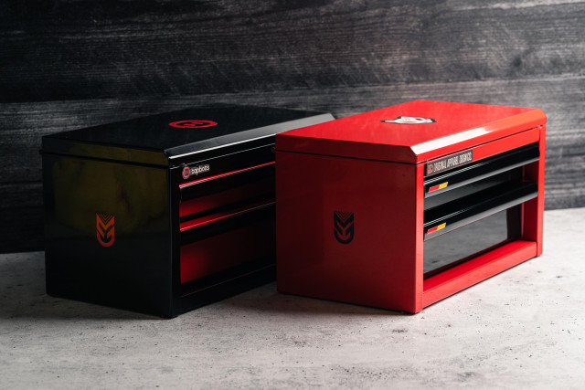 Photo of 2 customized Harbor Freight mini toolboxes. One is black with red accents and Tapbots themed while the other is red with black accents and themed after my upcoming apparel brand project.

In this photo, the lid is completely closed showing stickers on top of the lid.