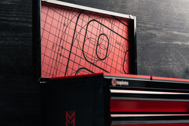 Detail of the the Tapbots lid which shows a blueprint sketch of the Weightbot icon.