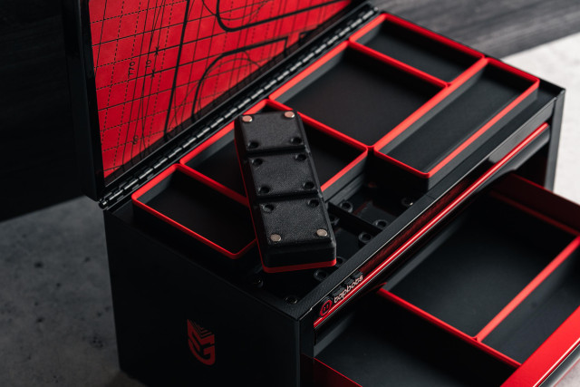 Detail showing the gridfinity bins that were 3d printed with magnets inserted so they stay in place. 