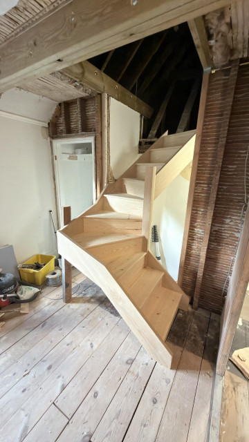 installed bespoke wooden staircase with winders, fitted by Kent staircase installers for expert staircase refurbishment.