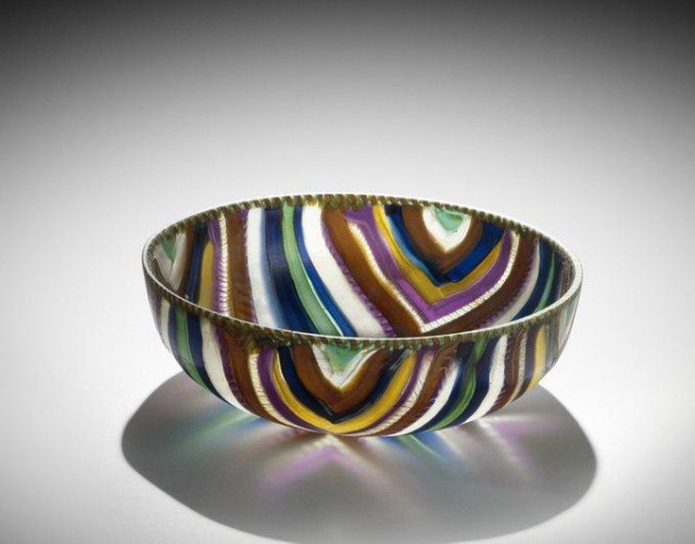Fascinating world of ancient glass: The skill of ancient glassmakers never ceases to amaze me. 
This a magnificent #Roman striped mosaic bowl was made of preformed rods and canes fused on or in a mold. 
Dating late 1st c. BC/early 1st c AD.
Timeless beauty!
📷 Corning Museums of Glass
