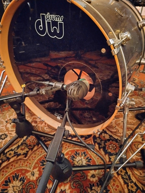Photo of a D112 outside the kick drum. Inside there's a SM57.