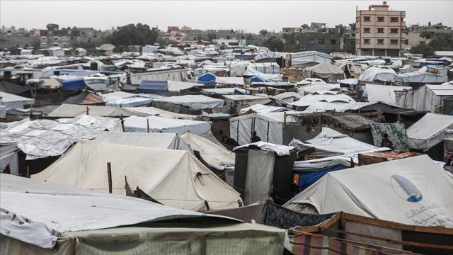 A camp of tents in the middle of the rain in Gaza.