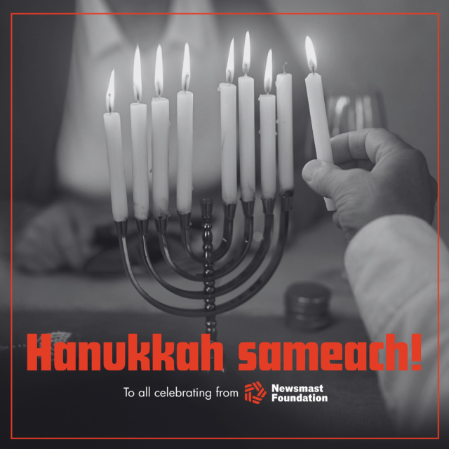 A black and white image of a person lighting a candle on a shammash. Over it, text reads: "Hanukkah sameach! To all celebrating from Newsmast Foundation"