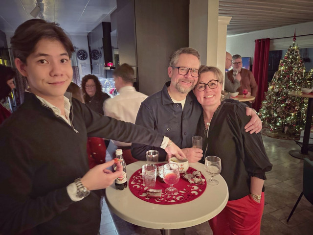 People at a party drinking glögg, a fortified wine drink, somewhat like gluhwine, but good.