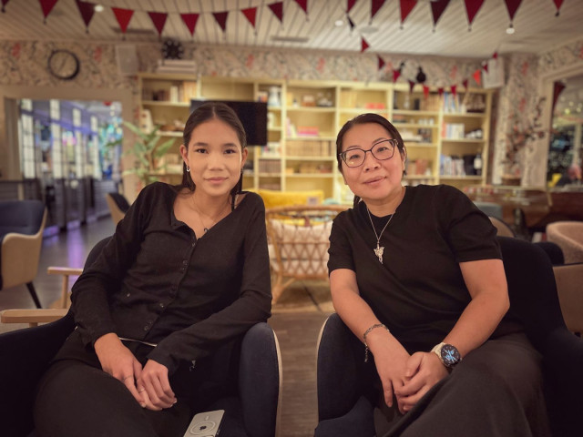 My daughter and wife sitting in a lounge waiting for Xmas dinner.